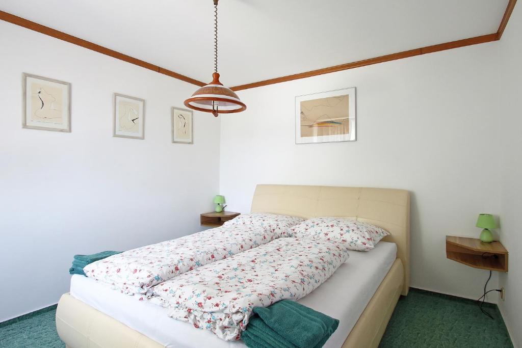 Postel nebo postele na pokoji v ubytování Apartmány HABURA