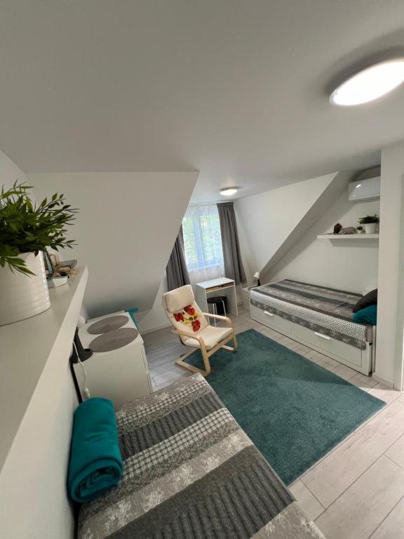 Postel nebo postele na pokoji v ubytování Apartman Nábrežná