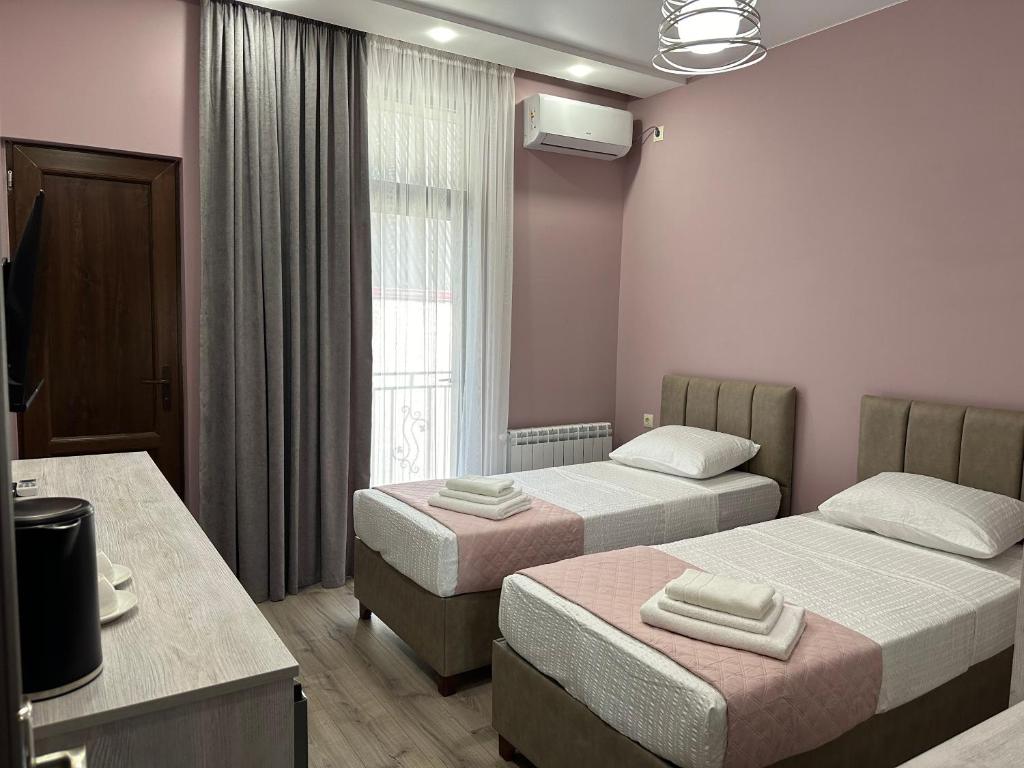 Letto o letti in una camera di Ameli Apartments BTM