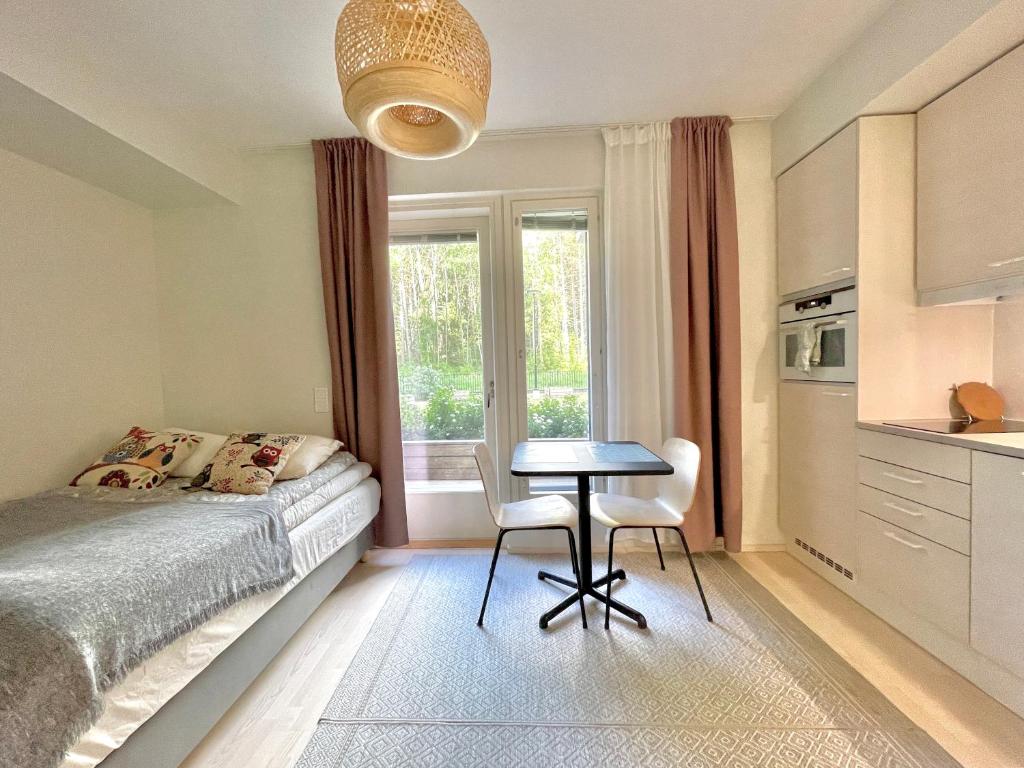 Postel nebo postele na pokoji v ubytování Haalia Homes Turku Pääskynpesä