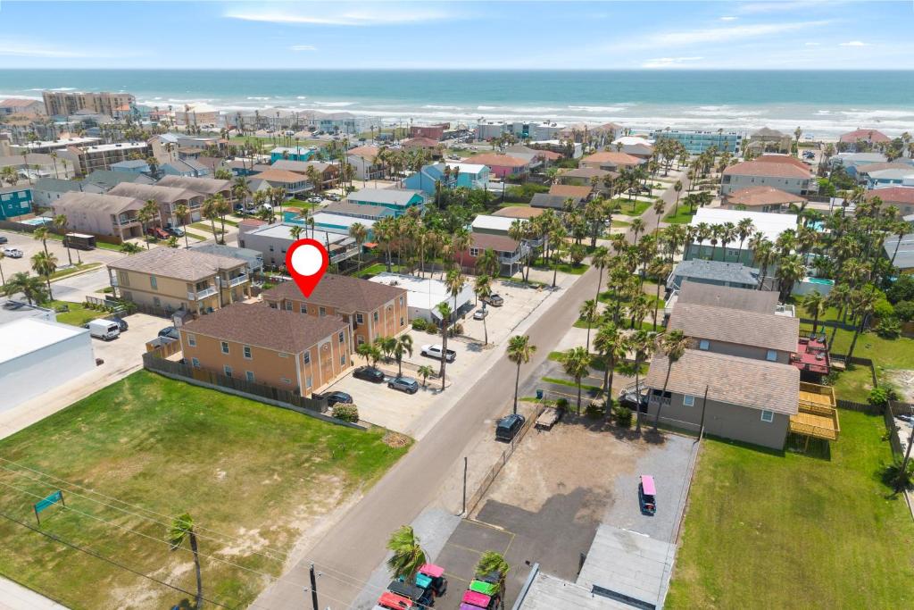 an aerial view of a city with a red arrow at Luxury 3 Bed 2 Bath 1st Floor Condo Near Beach in South Padre Island