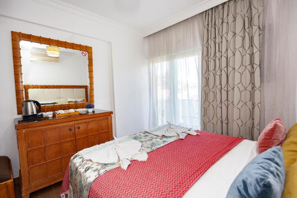 Postel nebo postele na pokoji v ubytování London Hotel