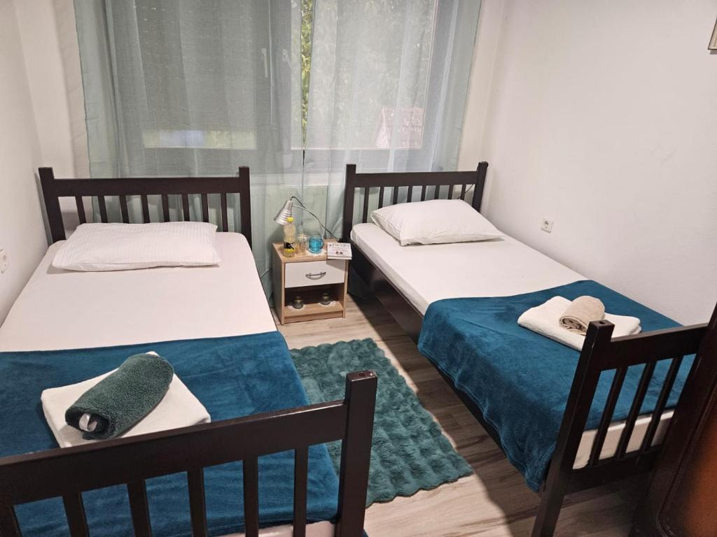 Postel nebo postele na pokoji v ubytování Apartmani, sobe Žiža