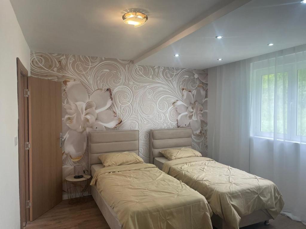 Postel nebo postele na pokoji v ubytování Villa Albatros
