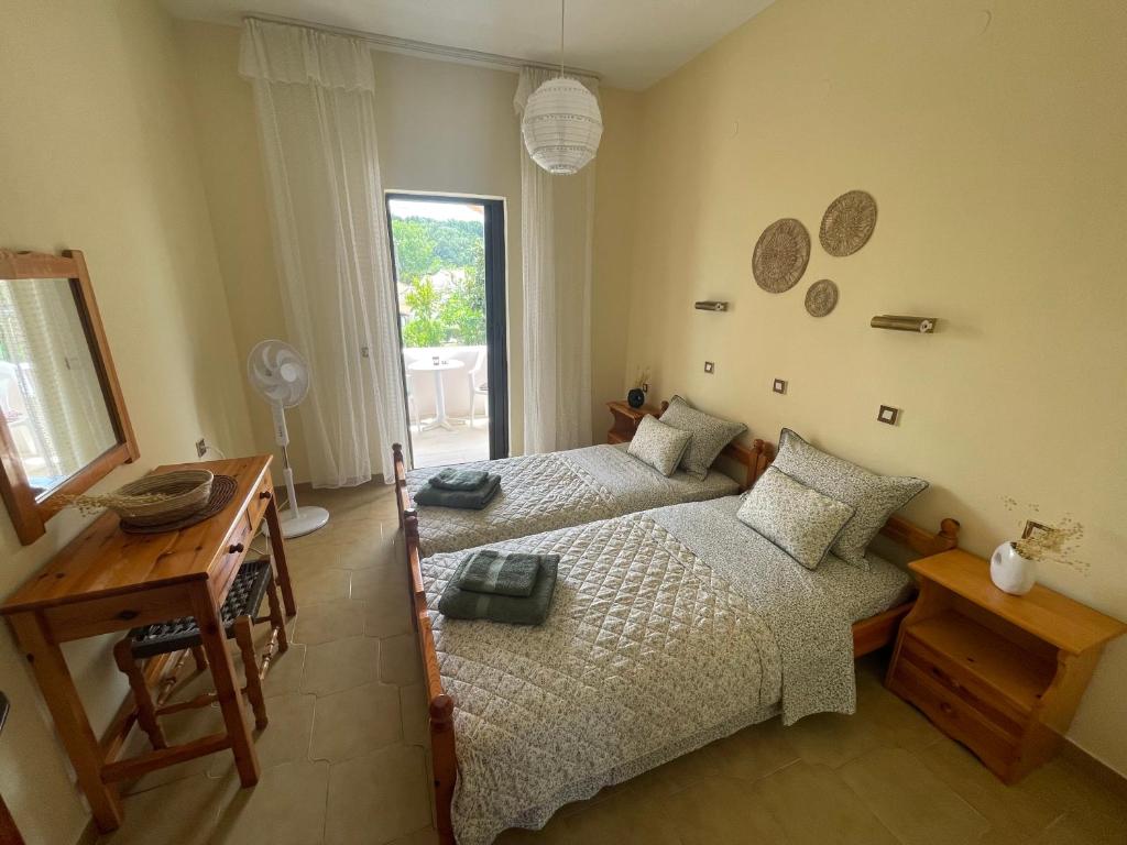 Postel nebo postele na pokoji v ubytování Stay Corfu Studios