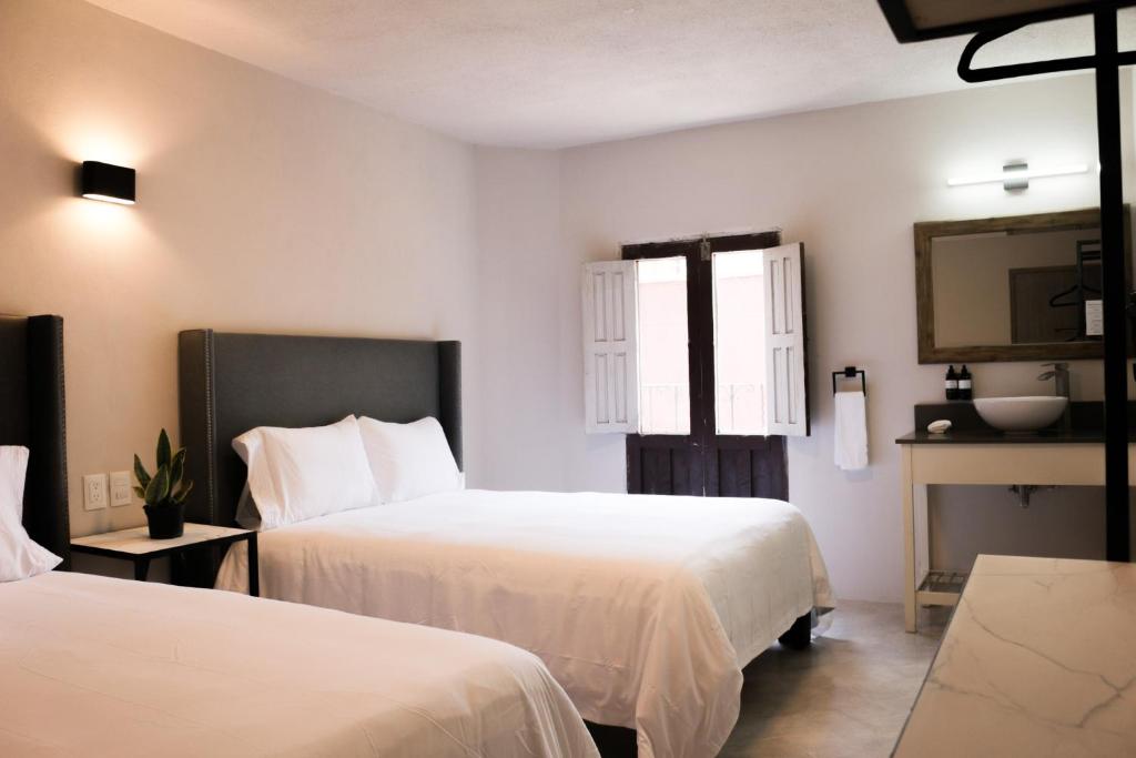 Postel nebo postele na pokoji v ubytování Casa Relox 43