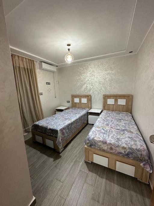 Postel nebo postele na pokoji v ubytování appartement moderne vue piscine