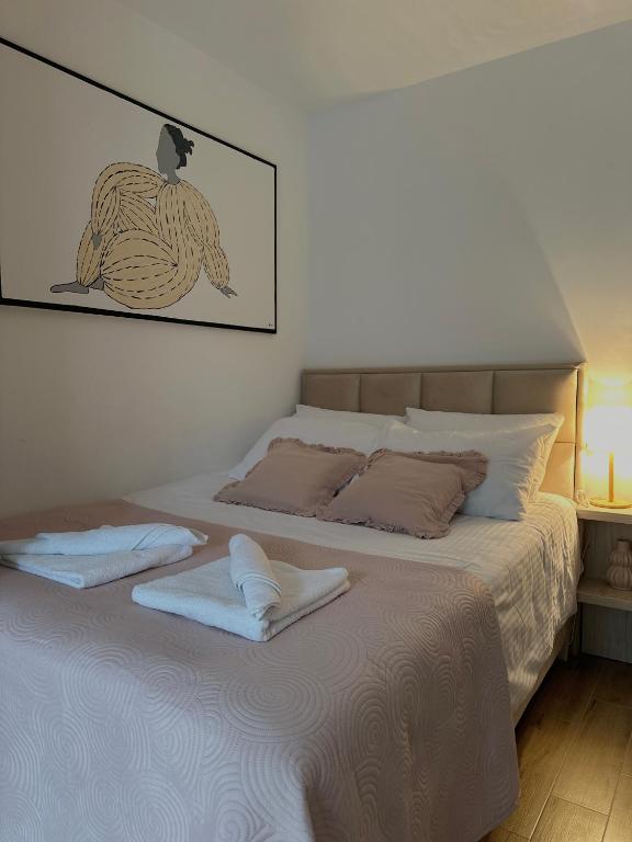 Postel nebo postele na pokoji v ubytování AS Divcibare