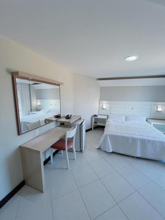 Postel nebo postele na pokoji v ubytování Violeta Meaípe Hotel