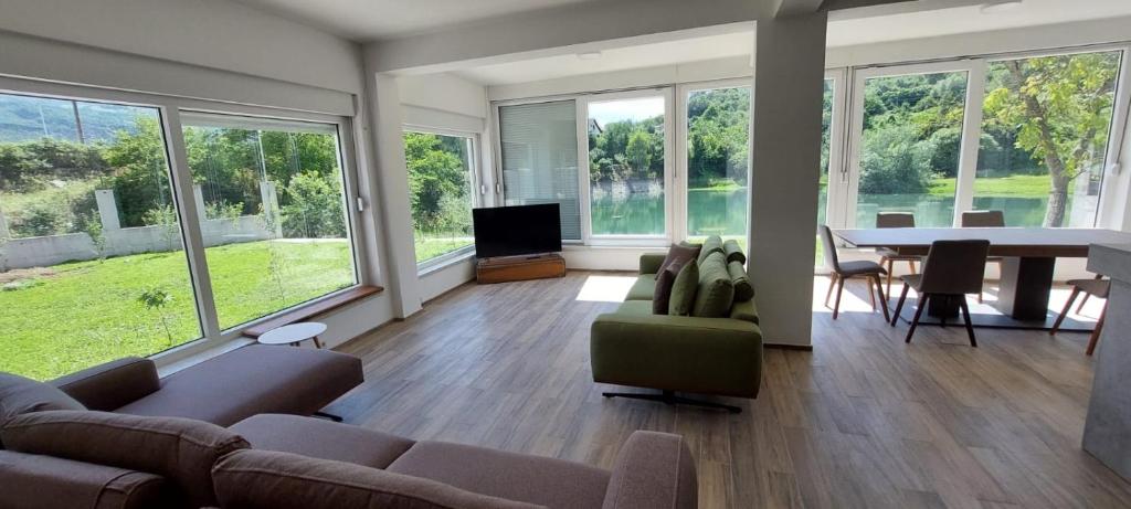 a living room with a couch and a table at Meem in Konjic