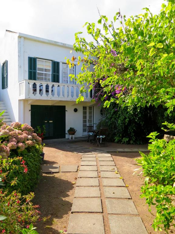 a house with a walkway in front of it at Quinta das Buganvílias in Castelo Branco