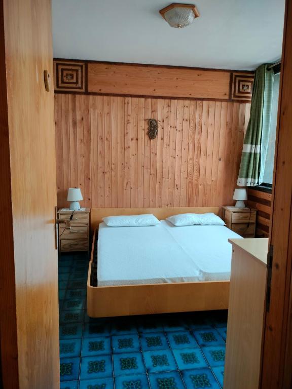 Posteľ alebo postele v izbe v ubytovaní TERRAZZA SULLE DOLOMITI