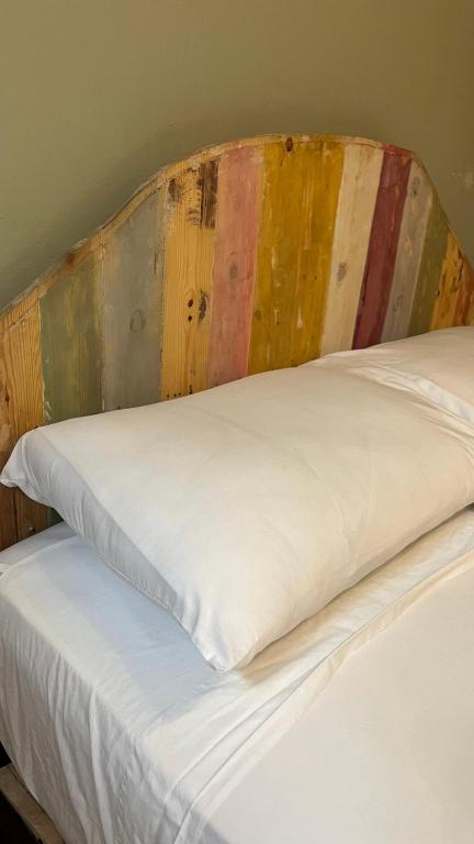 Postel nebo postele na pokoji v ubytování Hostal Casa Astromelia