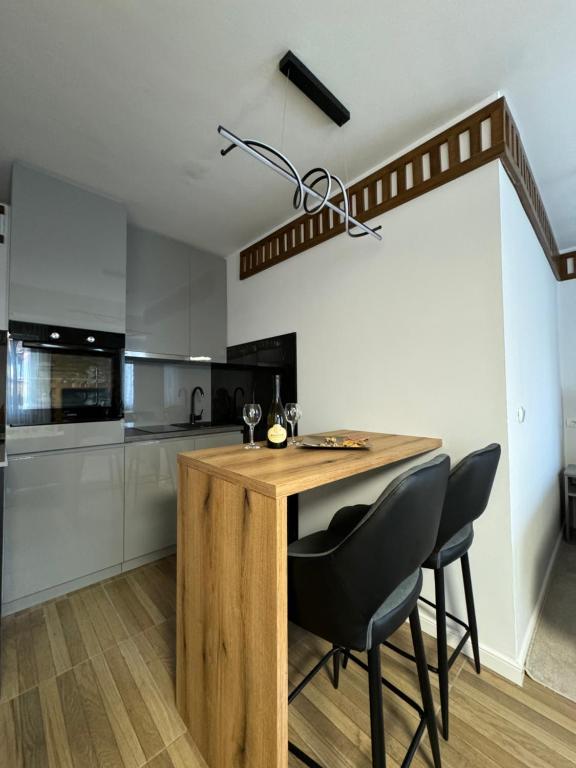 Kuchyň nebo kuchyňský kout v ubytování Apartments Radović