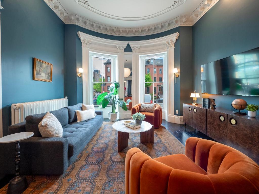 a living room with a couch and a table at The Chester Hotel in Boston