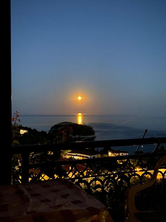 a view of the sunset from a balcony at Betsanis Stafylos Apartments in Stafylos