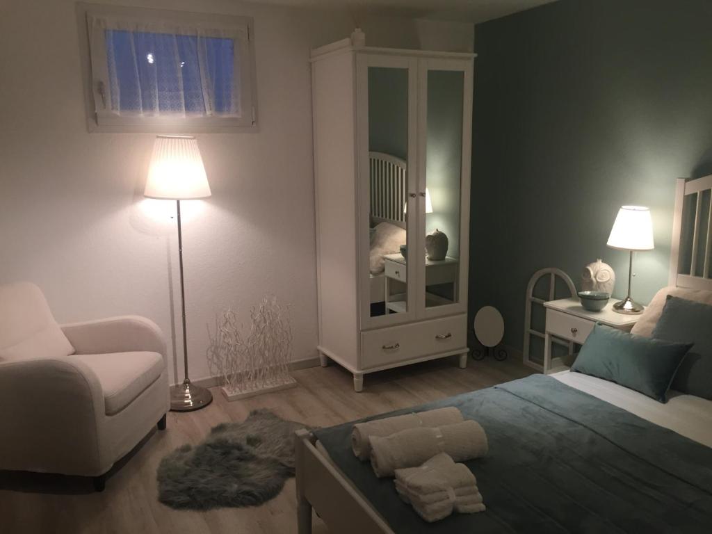 Postel nebo postele na pokoji v ubytování B&B Nathalie
