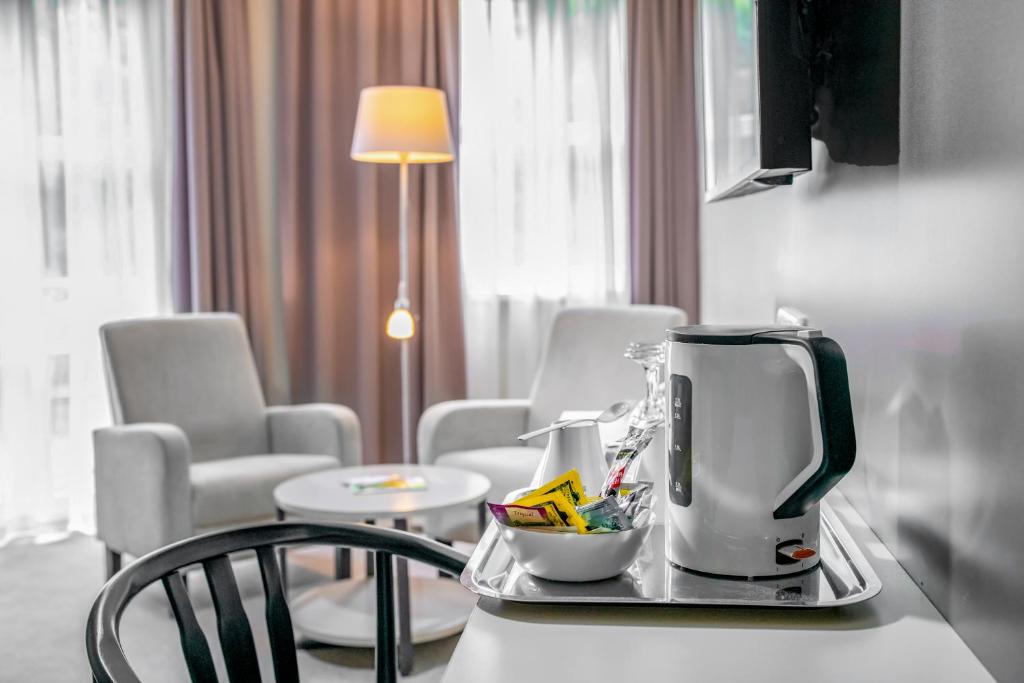 TV a/nebo společenská místnost v ubytování Corvin Hotel Budapest Corvin Wing