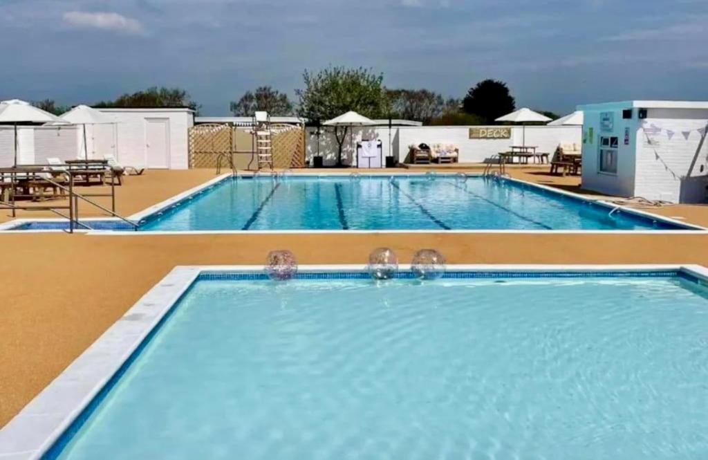 a large swimming pool at a hotel at 50 Toledo, Selsey Country club in Selsey
