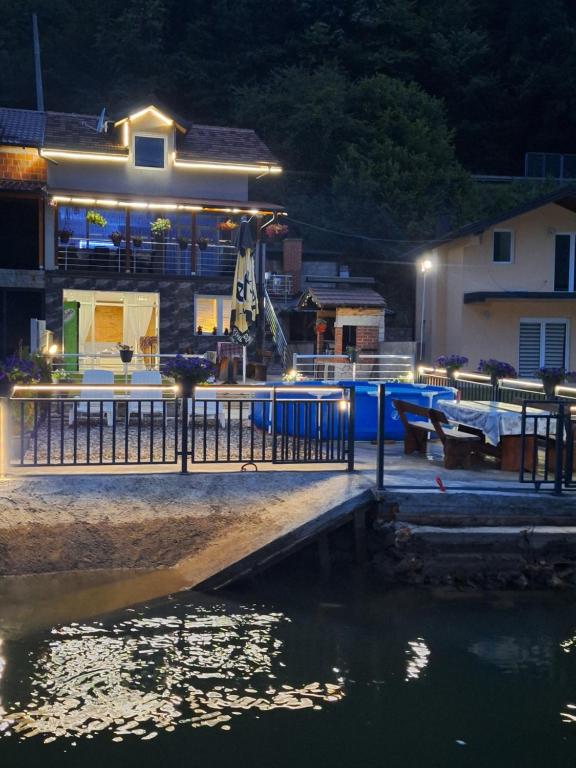 a house with a swimming pool at night at Vila Gavrić in Zvornik