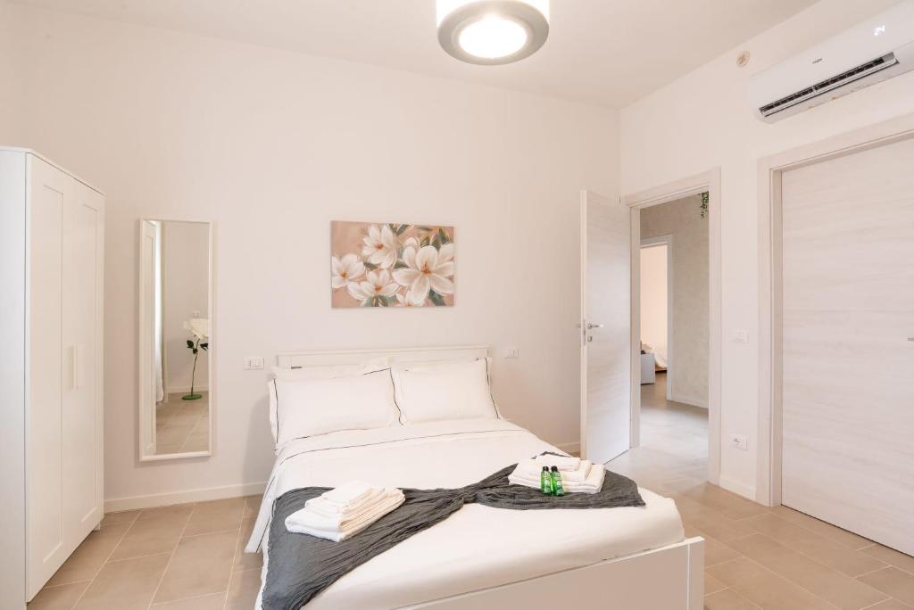 Postel nebo postele na pokoji v ubytování Mentana Guest House
