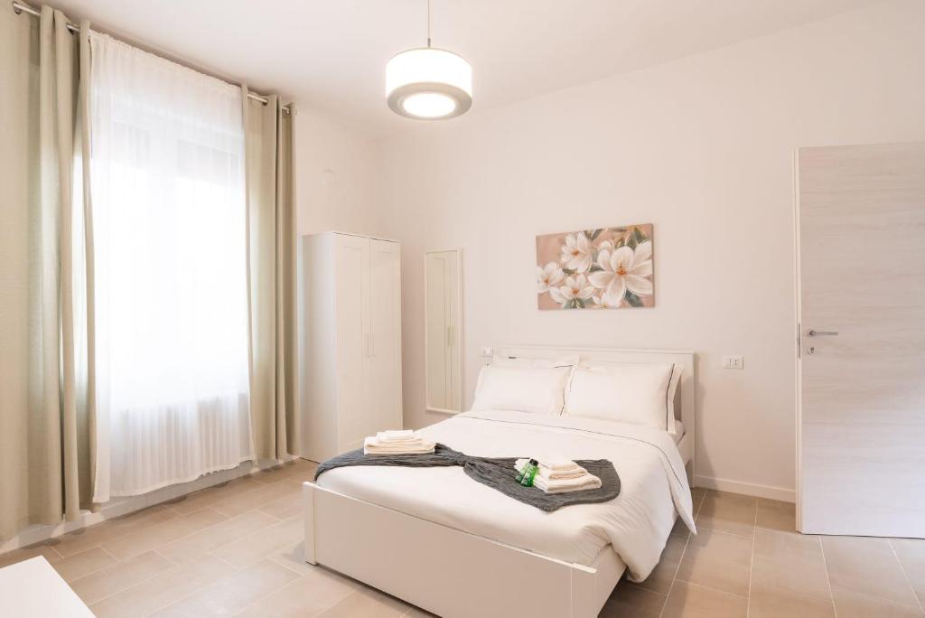 Postel nebo postele na pokoji v ubytování Mentana Guest House