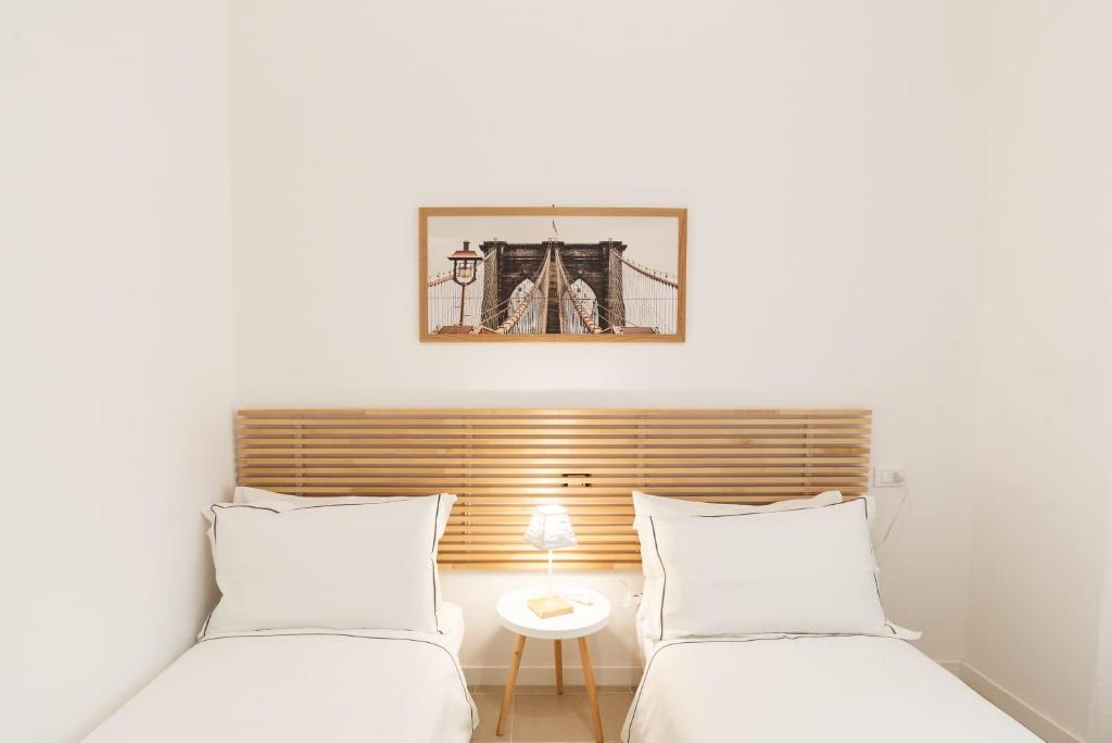 Postel nebo postele na pokoji v ubytování Mentana Guest House