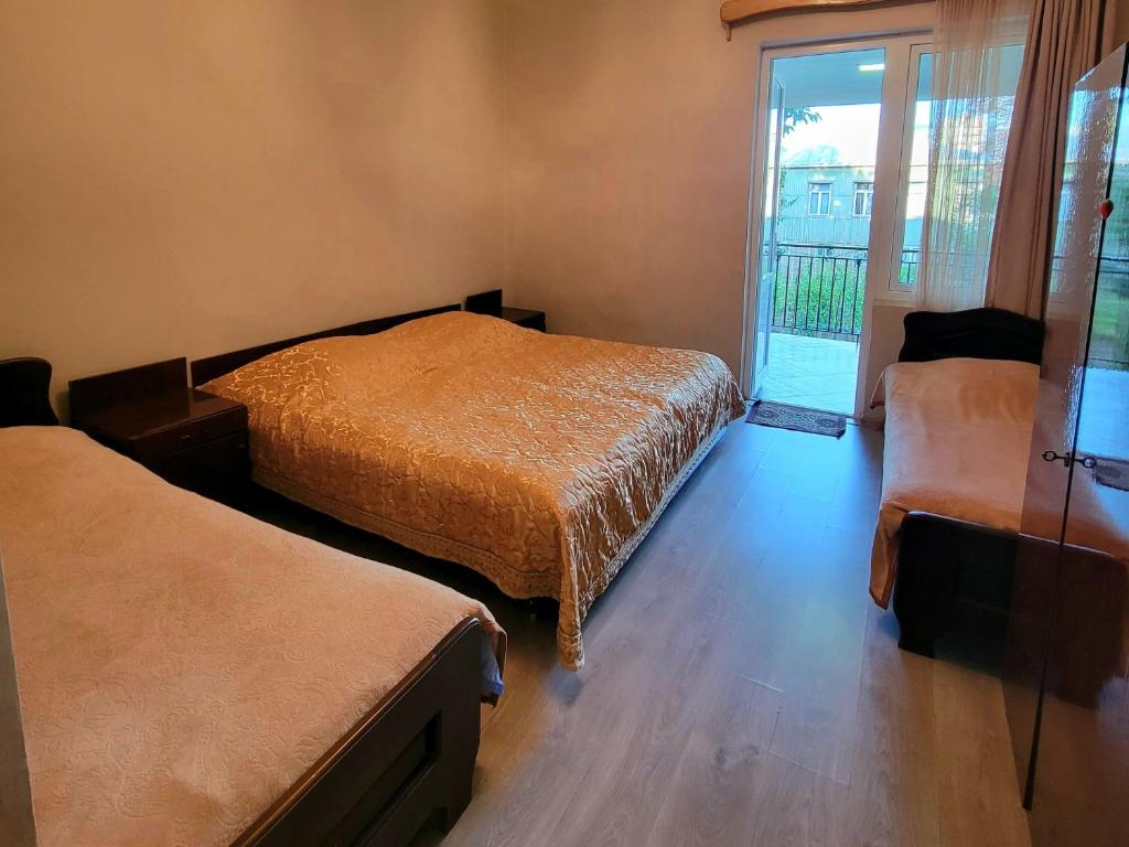 Postel nebo postele na pokoji v ubytování Temo's guest house kobuleti