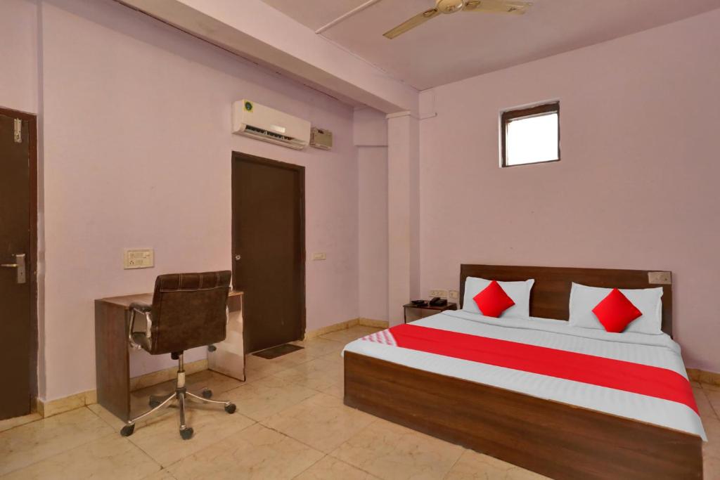 Postel nebo postele na pokoji v ubytování Hotel O Doraemon Residency
