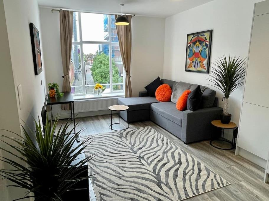 a living room with a couch and a zebra rug at Nero view, Southend City High Street in Southend-on-Sea