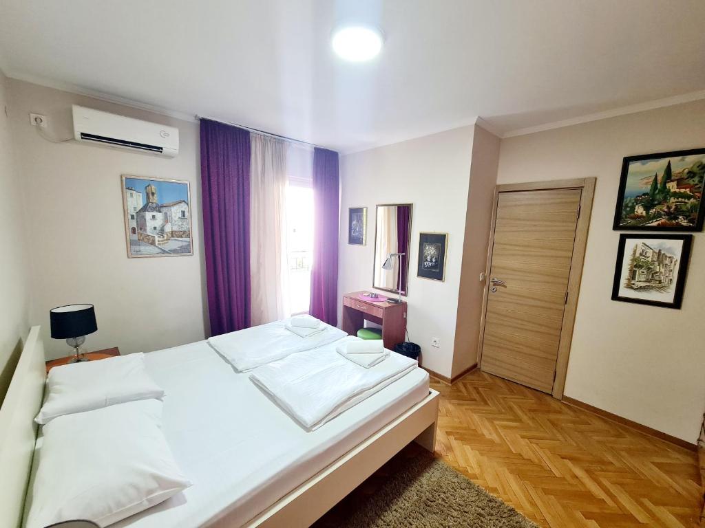 Postel nebo postele na pokoji v ubytování Apartments Pier