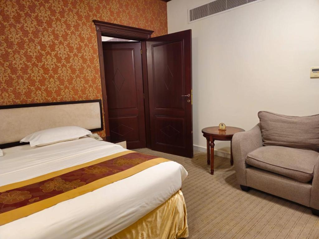 Postel nebo postele na pokoji v ubytování Twilight Hotel