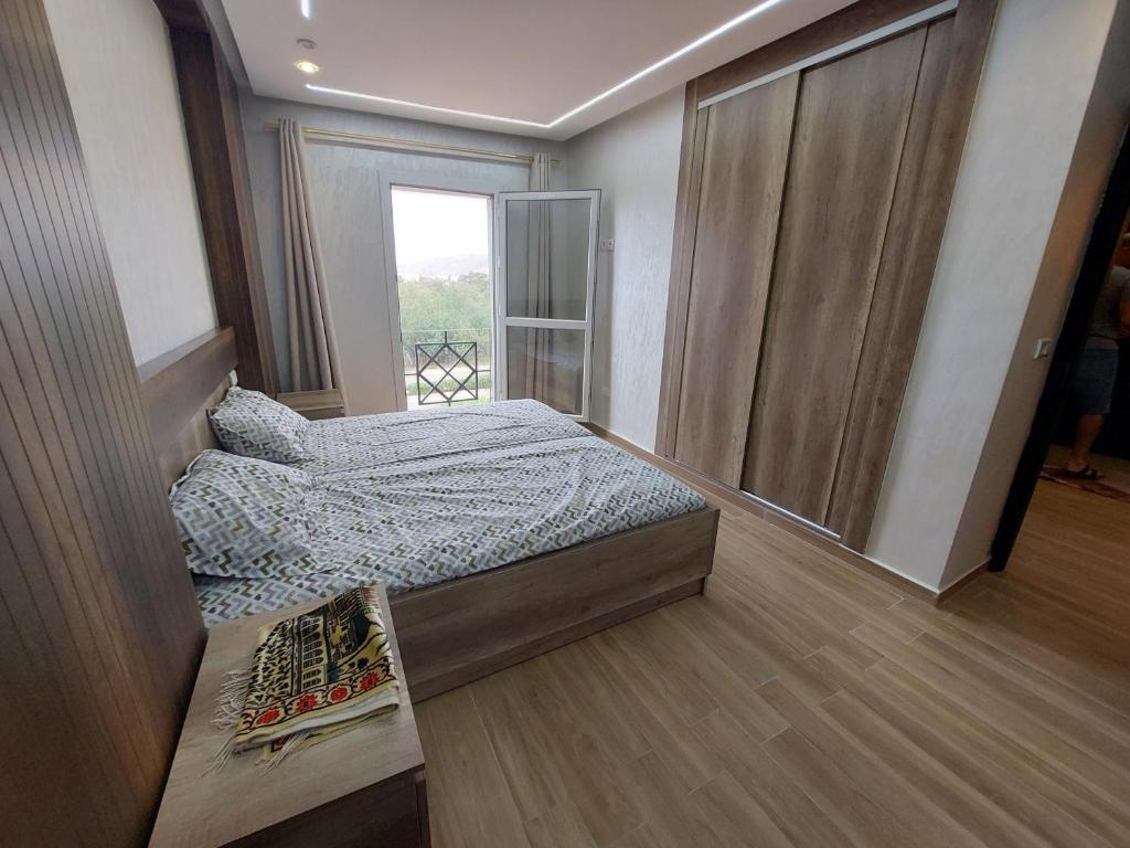 Postel nebo postele na pokoji v ubytování Fenêtre sur le paradis