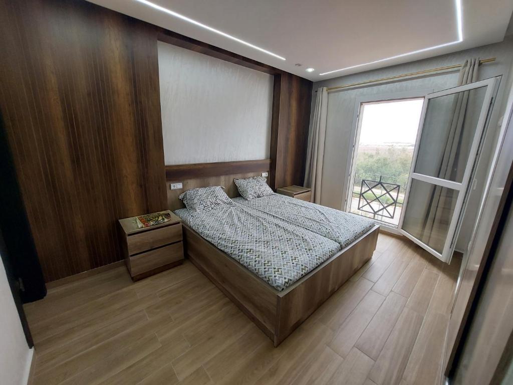 Postel nebo postele na pokoji v ubytování Fenêtre sur le paradis