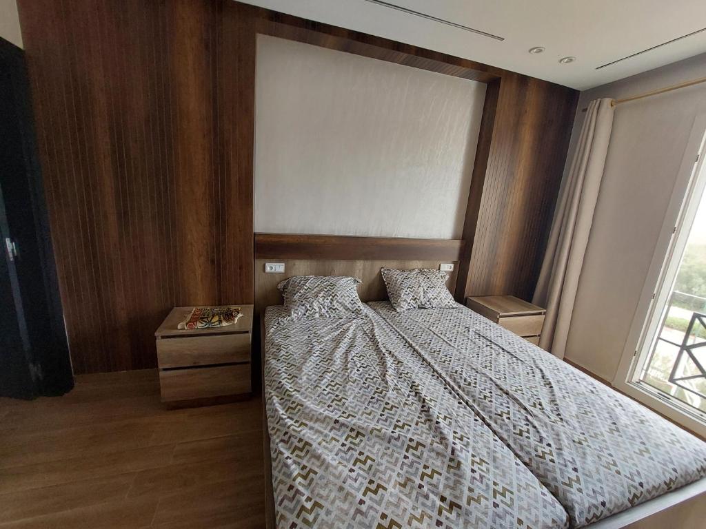 Postel nebo postele na pokoji v ubytování Fenêtre sur le paradis