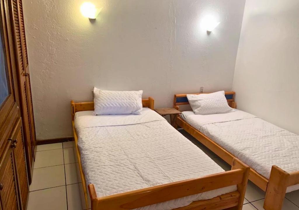 Postel nebo postele na pokoji v ubytování Hermosa casa frente a la playa
