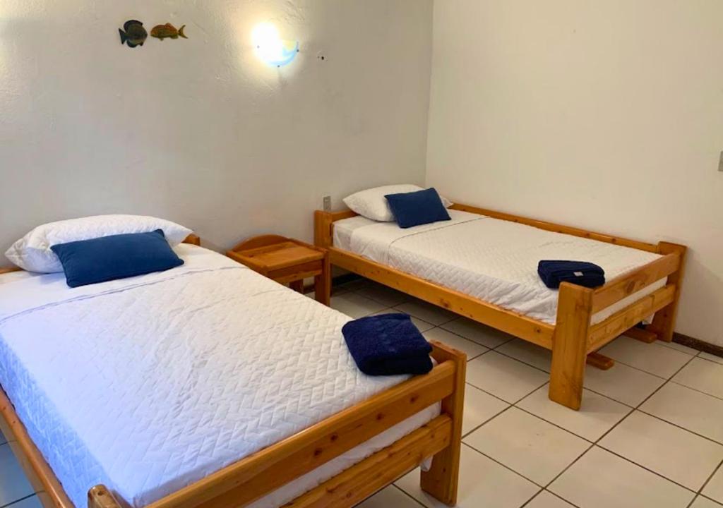 Postel nebo postele na pokoji v ubytování Hermosa casa frente a la playa