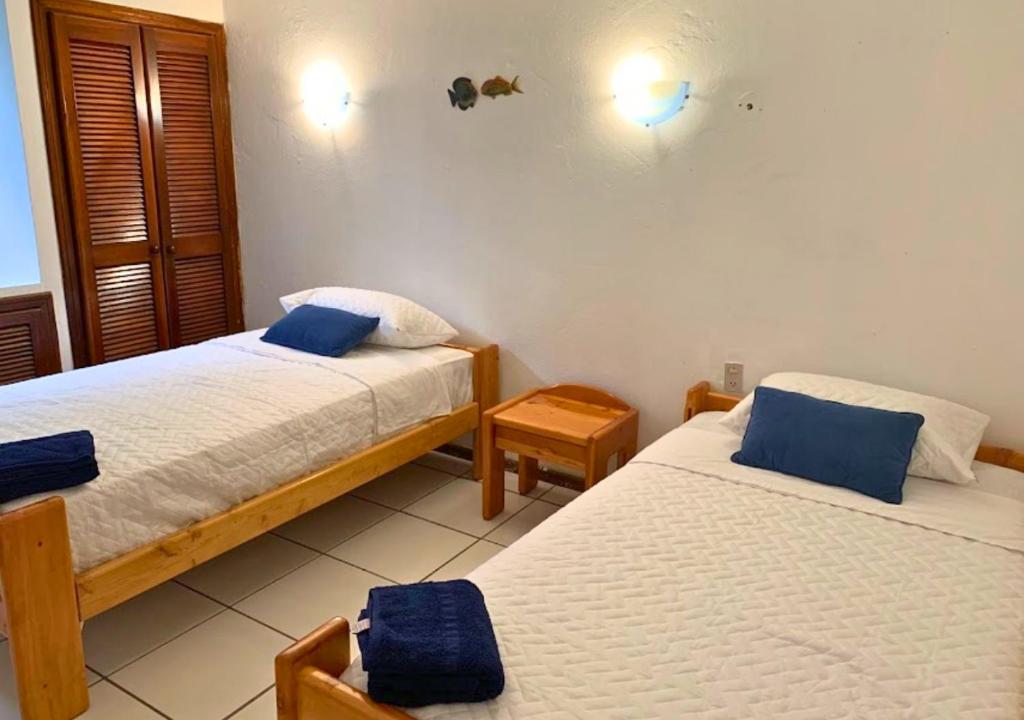Postel nebo postele na pokoji v ubytování Hermosa casa frente a la playa