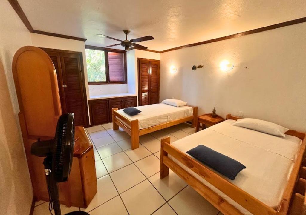 Postel nebo postele na pokoji v ubytování Hermosa casa frente a la playa