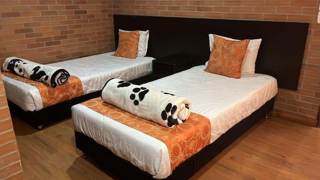 Postel nebo postele na pokoji v ubytování Hotel Bogota Astral