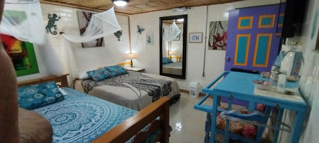 Postel nebo postele na pokoji v ubytování Finca San Miguel Filandia