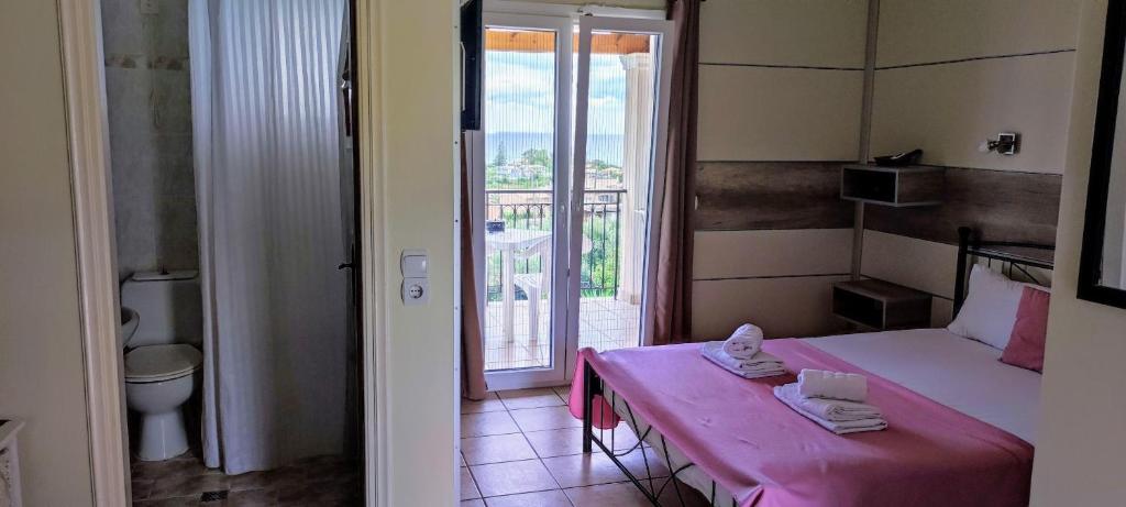 Postel nebo postele na pokoji v ubytování Catamaran Corfu Aparthotel