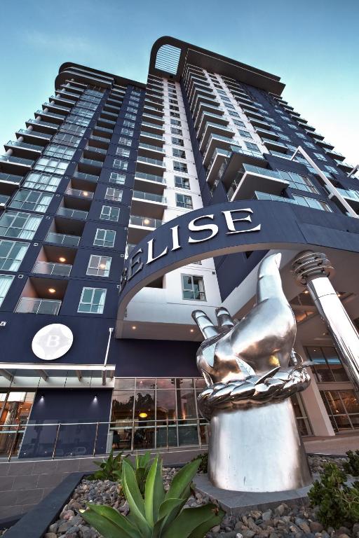 a building with a statue in front of it at Belise Apartments in Brisbane