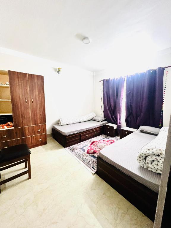 Postel nebo postele na pokoji v ubytování Muma Home Stay