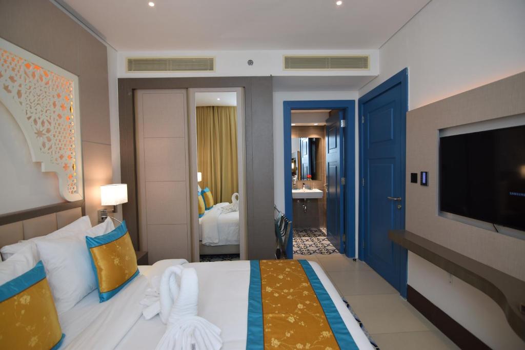 Postel nebo postele na pokoji v ubytování Central Inn Souq Waqif
