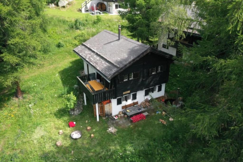 an aerial view of a house in a field at Chalet Silentium in Bellwald