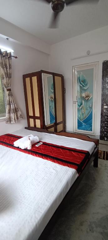 Postel nebo postele na pokoji v ubytování Regencyy Guest House