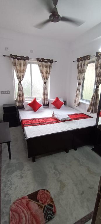 Postel nebo postele na pokoji v ubytování Regencyy Guest House