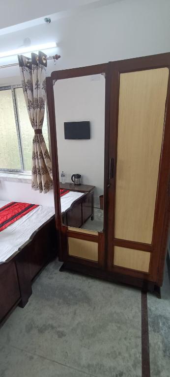 Postel nebo postele na pokoji v ubytování Regencyy Guest House