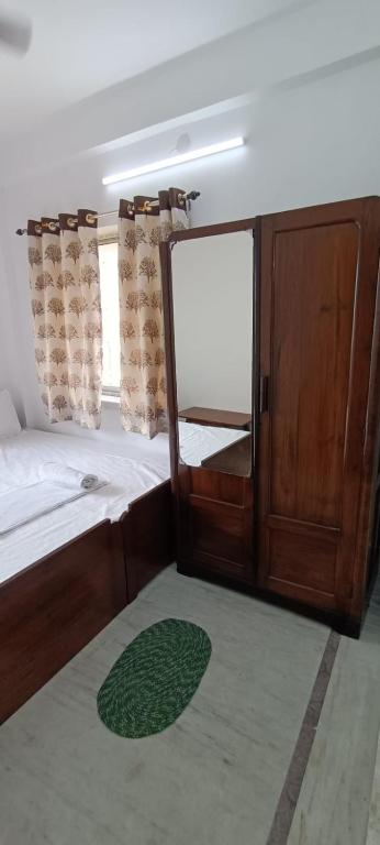 Postel nebo postele na pokoji v ubytování Regencyy Guest House